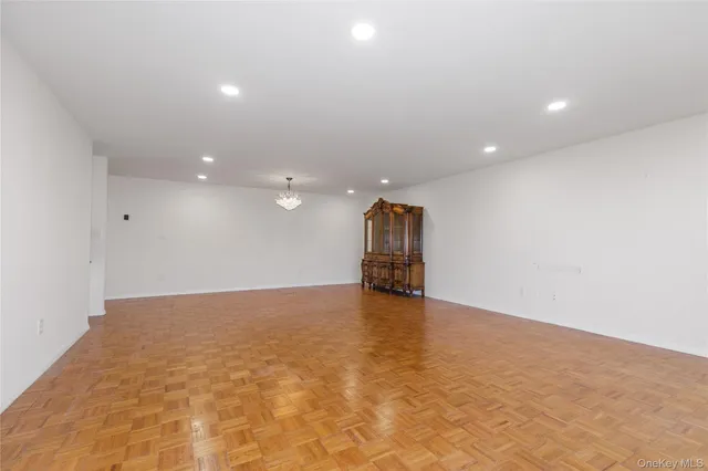 a kitchen with granite countertop a refrigerator and a sink