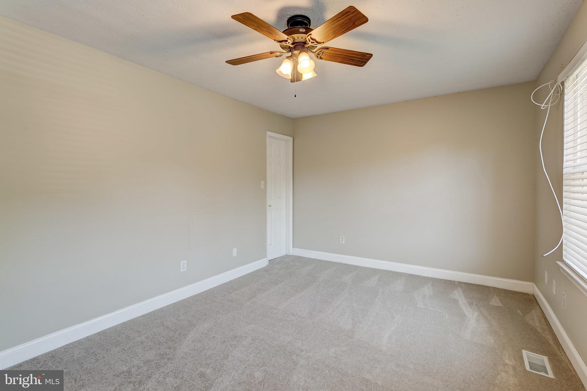 38 Powderock Place Baltimore, MD 21236 - Photo 16 of 42 Master Bedroom with ceiling fan & faux wood blinds