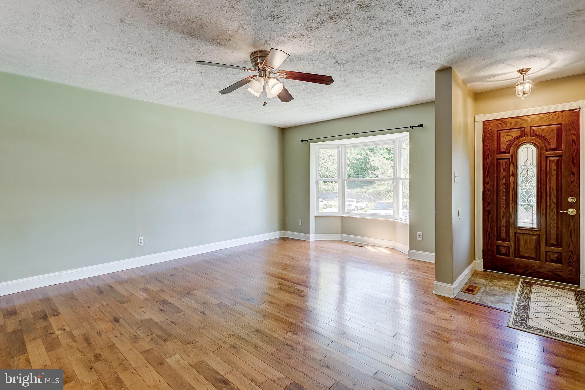 Gleaming hardwoods in living room & dining room