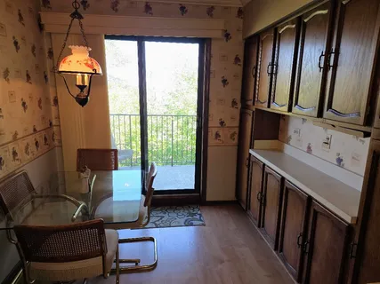 a bedroom with a bed couch and window