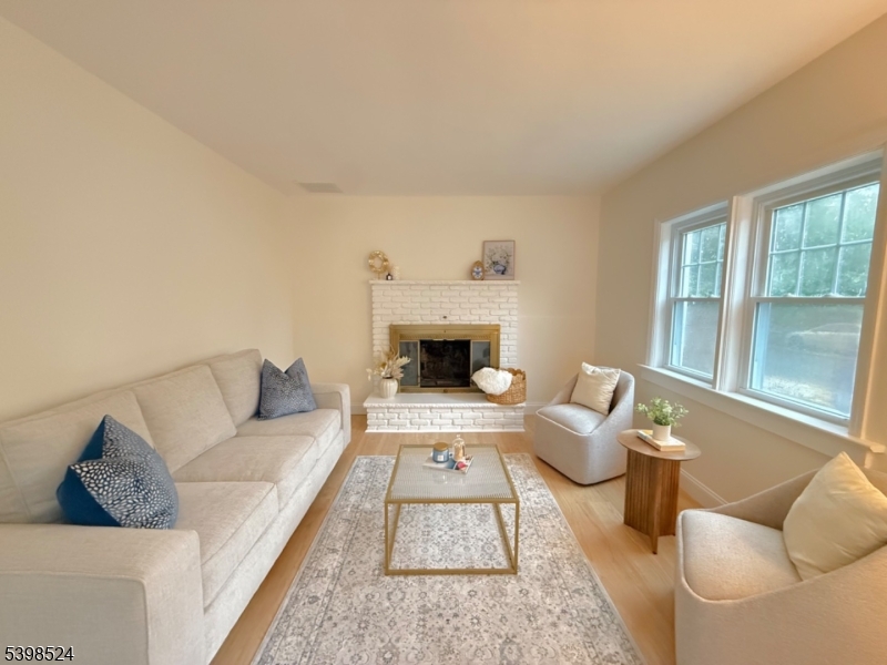 484 Bara Street Brick, NJ 08723 - Photo 3 of 15 a living room with furniture and a fireplace