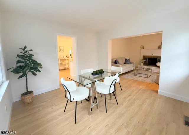 a view of a livingroom with furniture and a potted plant