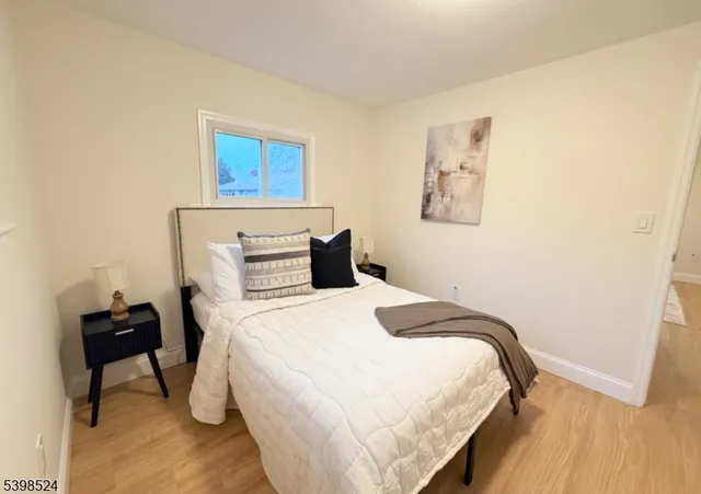 a bedroom with a bed and a desk