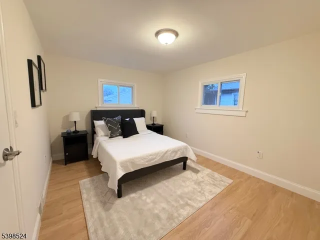 a bedroom with a bed and night stand