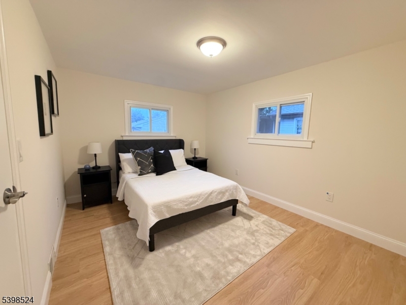 484 Bara Street Brick, NJ 08723 - Photo 10 of 15 a bedroom with a bed and night stand