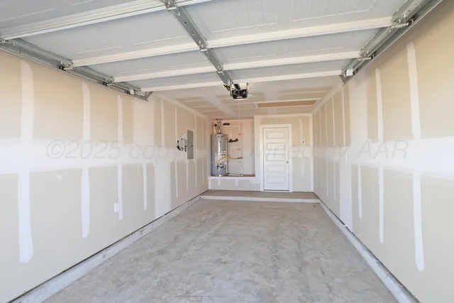 a view of a hallway with white walls and chandelier