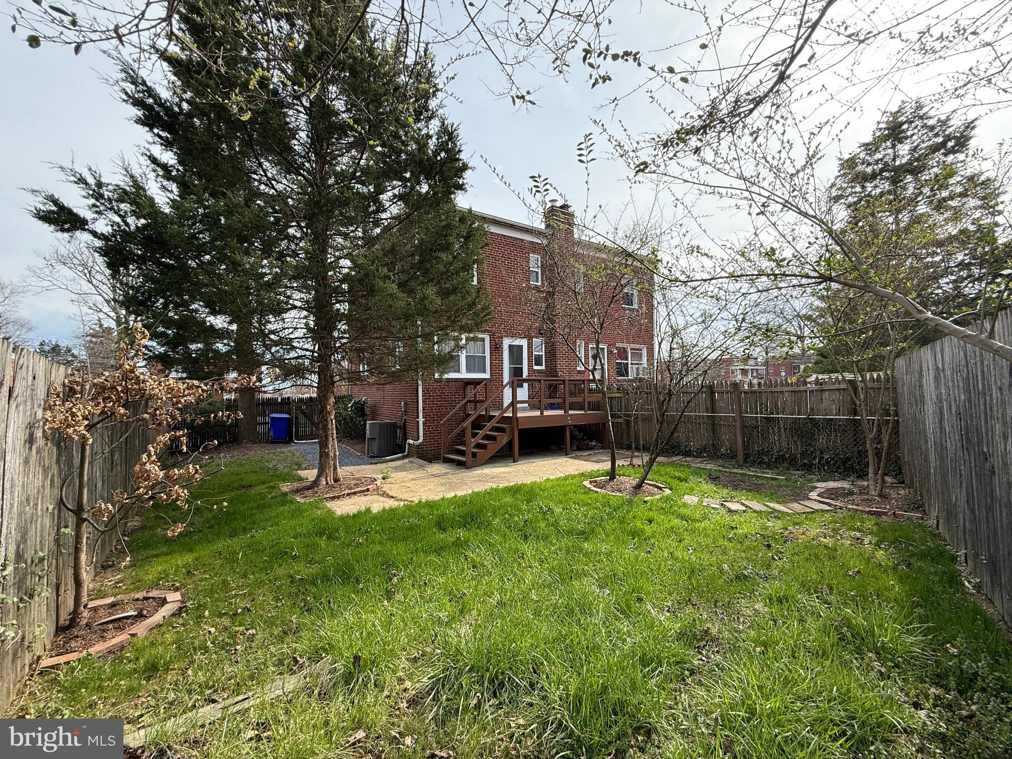 8518 11th Avenue Silver Spring, MD 20903 - Photo 11 of 13 a house with trees in front of it
