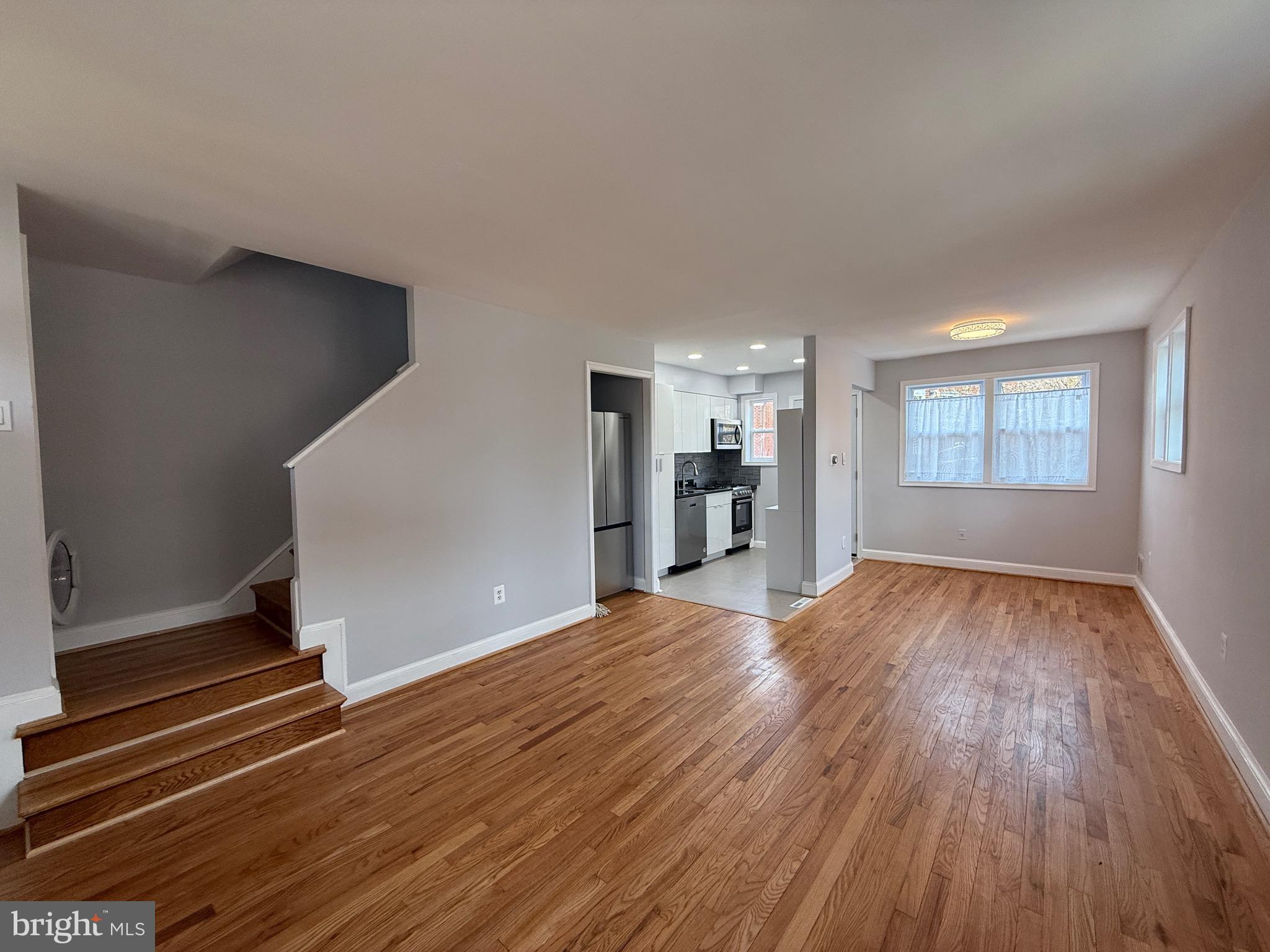 8518 11th Avenue Silver Spring, MD 20903 - Photo 3 of 13 a view of empty room with wooden floor and window