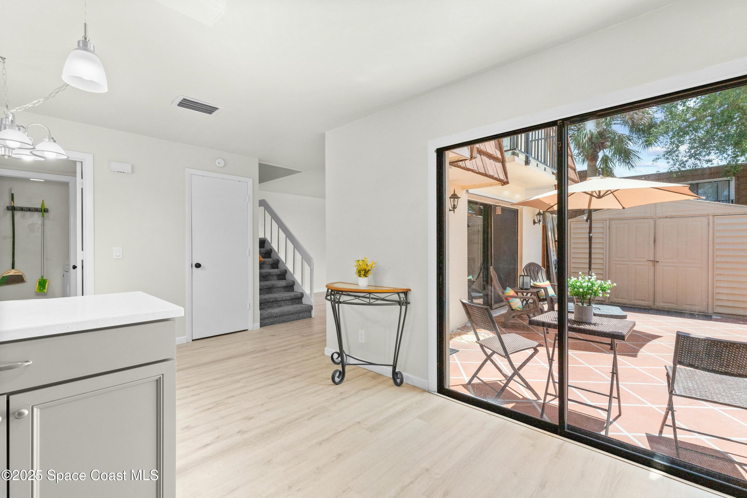 3311 Kaileen Circle Northeast Palm Bay, FL 32905 - Photo 11 of 26 Kitchen to Courtyard