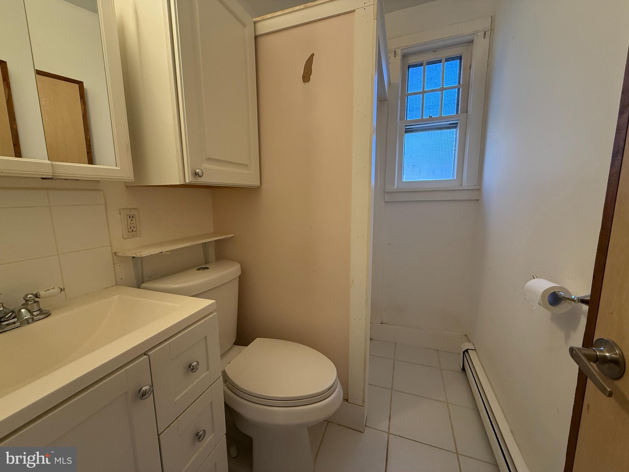 930 Tappan Street Forked River, NJ 08731 - Photo 10 of 13 a bathroom with a sink a toilet and shower