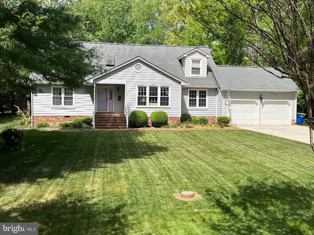 107 Valley View Road Fredericksburg, VA 22407 - Photo 2 of 2 a front view of a house with garden