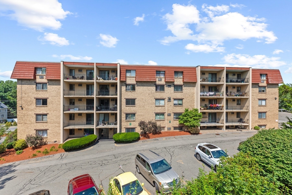 157 Franklin Street, Unit A10 Stoneham, MA 02180 - Photo 10 of 10 a front view of a building with street view