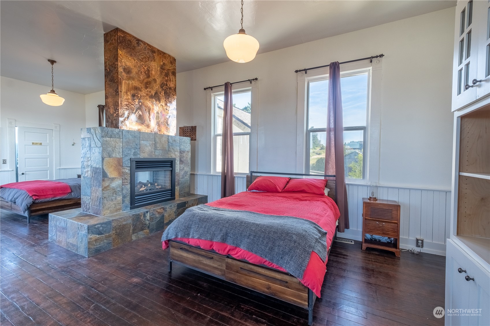 650 Zylstra Road Coupeville, WA 98239 - Photo 13 of 26 a bedroom with a bed and a fireplace