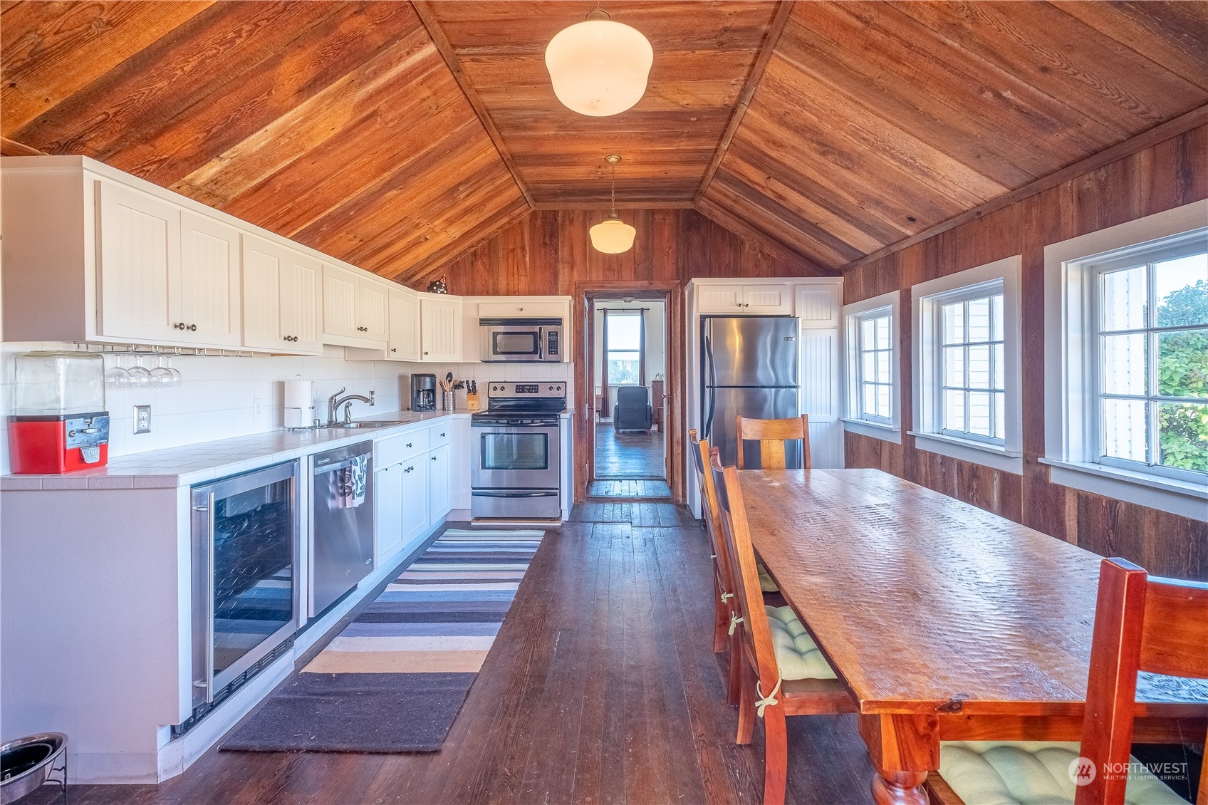 650 Zylstra Road Coupeville, WA 98239 - Photo 15 of 26 a large kitchen with lots of counter space wooden floor and stainless steel appliances