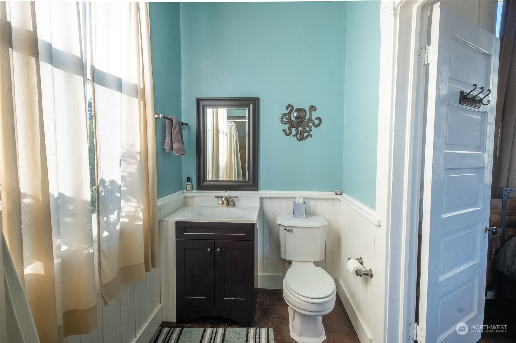 650 Zylstra Road Coupeville, WA 98239 - Photo 19 of 26 a bathroom with a granite countertop toilet a sink and a mirror