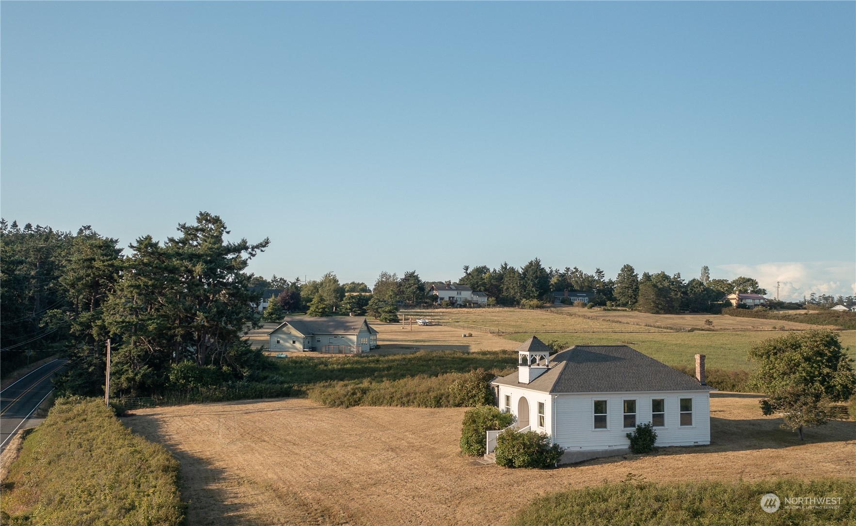 650 Zylstra Road Coupeville, WA 98239 - Photo 24 of 26 a view of a house with a yard and sitting area