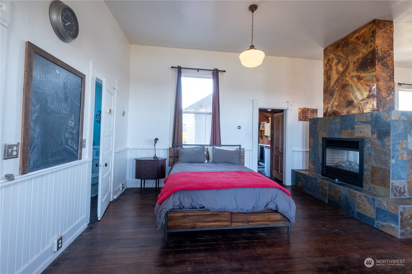 650 Zylstra Road Coupeville, WA 98239 - Photo 5 of 26 a view of bedroom with a bed and wooden floor
