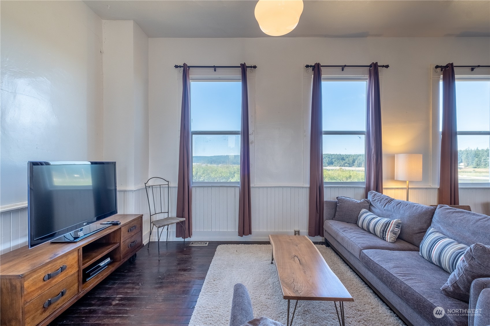 650 Zylstra Road Coupeville, WA 98239 - Photo 9 of 26 a living room with furniture and a flat screen tv