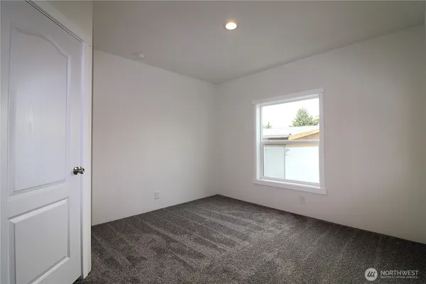 an empty room with a bathroom