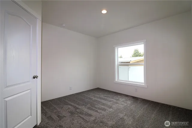an empty room with a bathroom