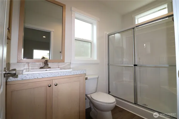 a view of a porch with wooden floor and a fireplace