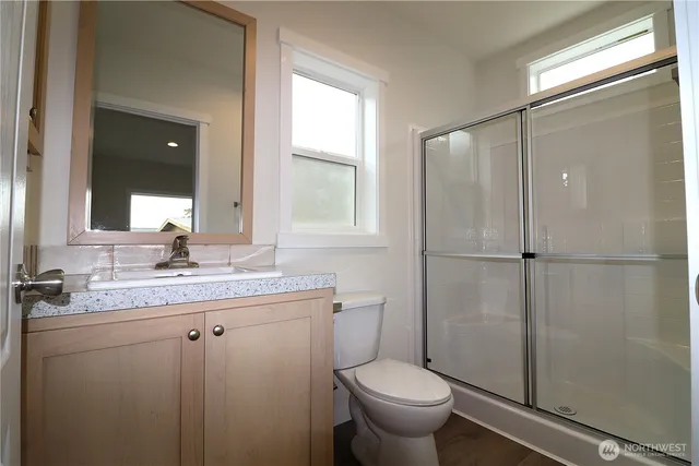 a view of a porch with wooden floor and a fireplace