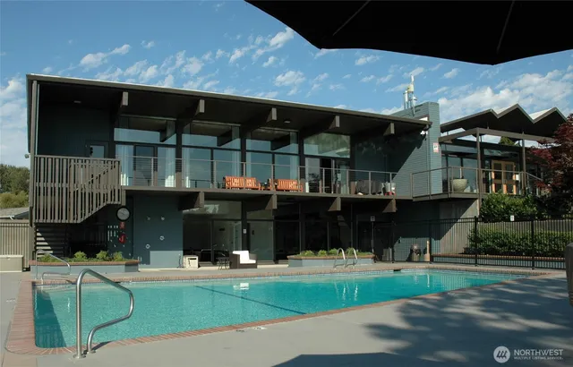 a view of a swimming pool with a yard
