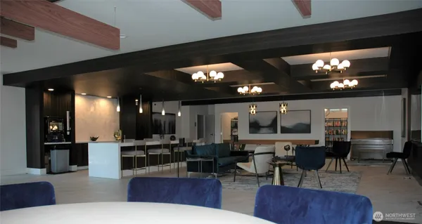 a view of a dining room with furniture and a book shelf