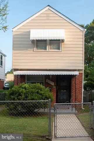 a front view of a house with a garage