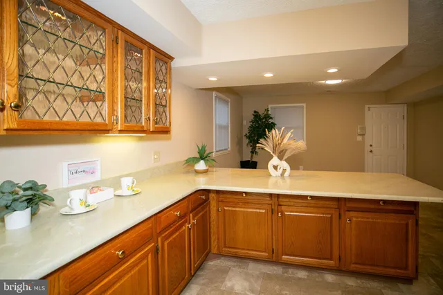 a kitchen with a sink and cabinets