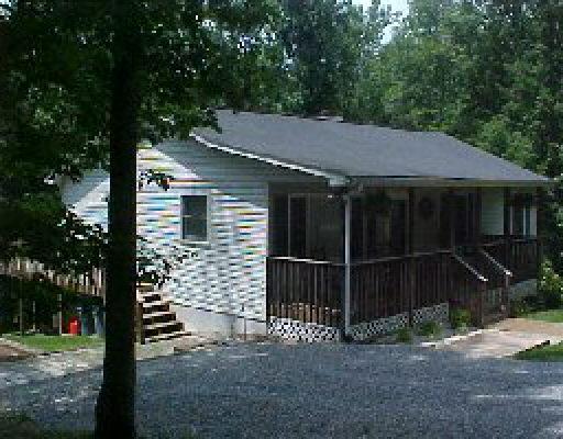 1005 Chandler Road Goodview, VA 24095 - Photo 2 of 3 a backyard of a house with lots of green space