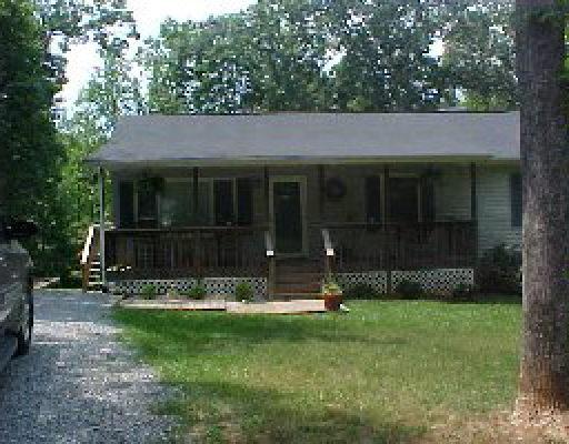 1005 Chandler Road Goodview, VA 24095 - Photo 3 of 3 a view of a house with yard and a garden