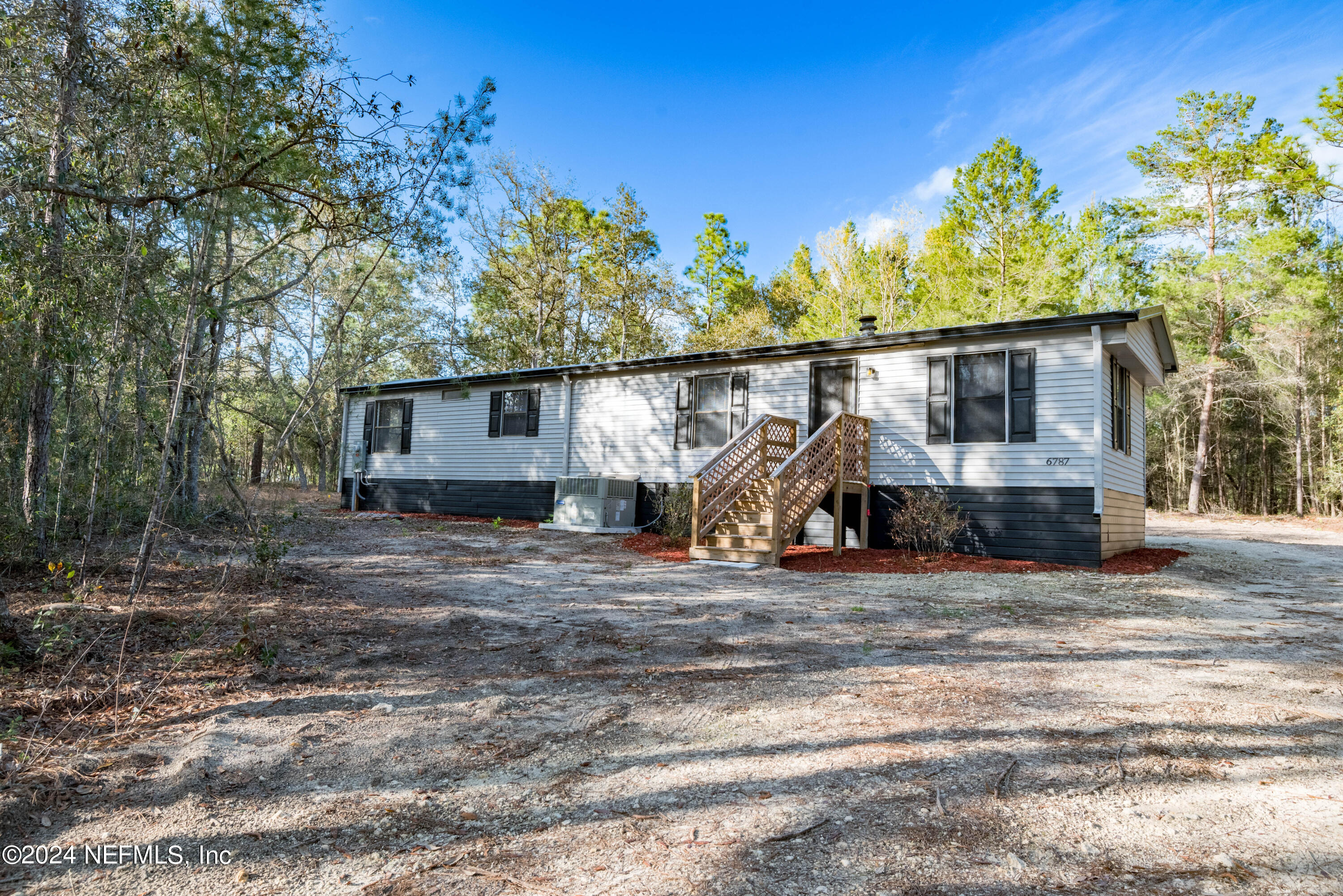 6787 Deer Springs Road Keystone Heights, FL 32656 - Photo 1 of 54 a view of a house with a patio