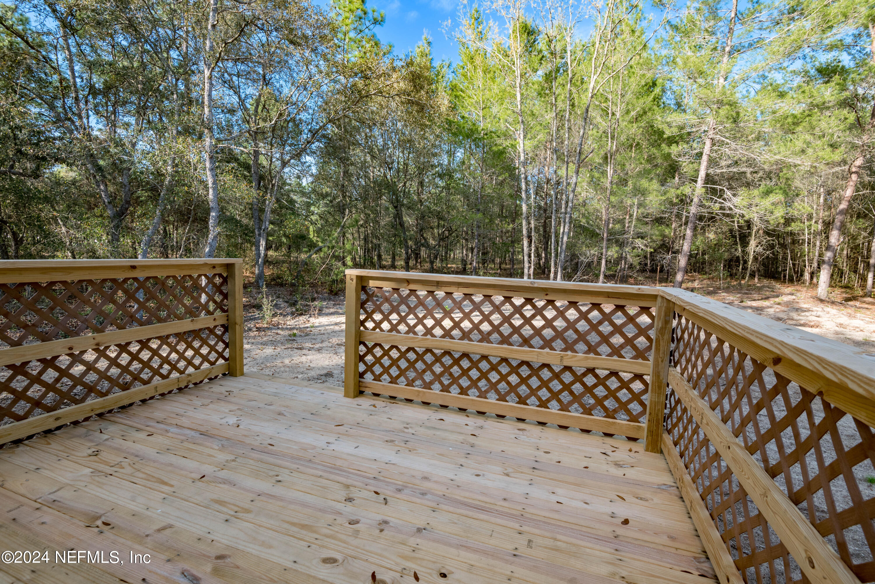 6787 Deer Springs Road Keystone Heights, FL 32656 - Photo 11 of 54 a side view of a wooden fence