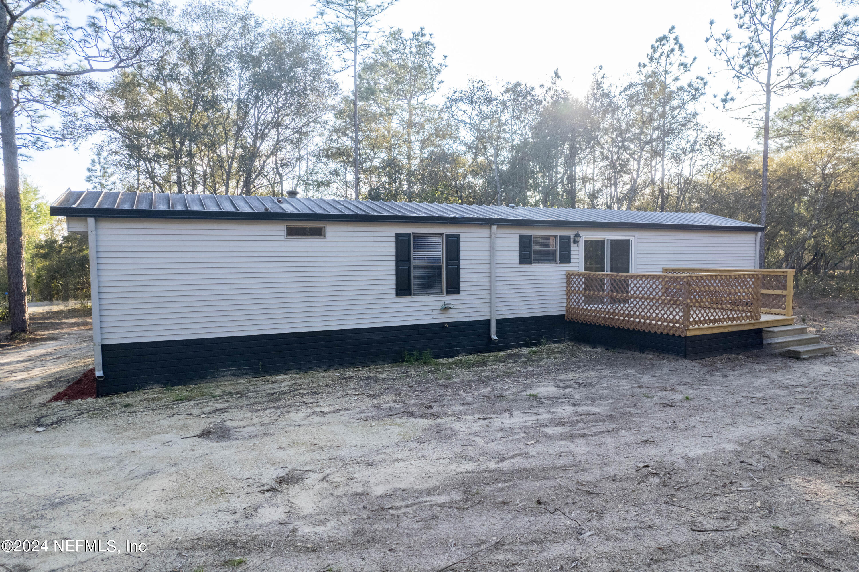 6787 Deer Springs Road Keystone Heights, FL 32656 - Photo 13 of 54 a view of back yard of house