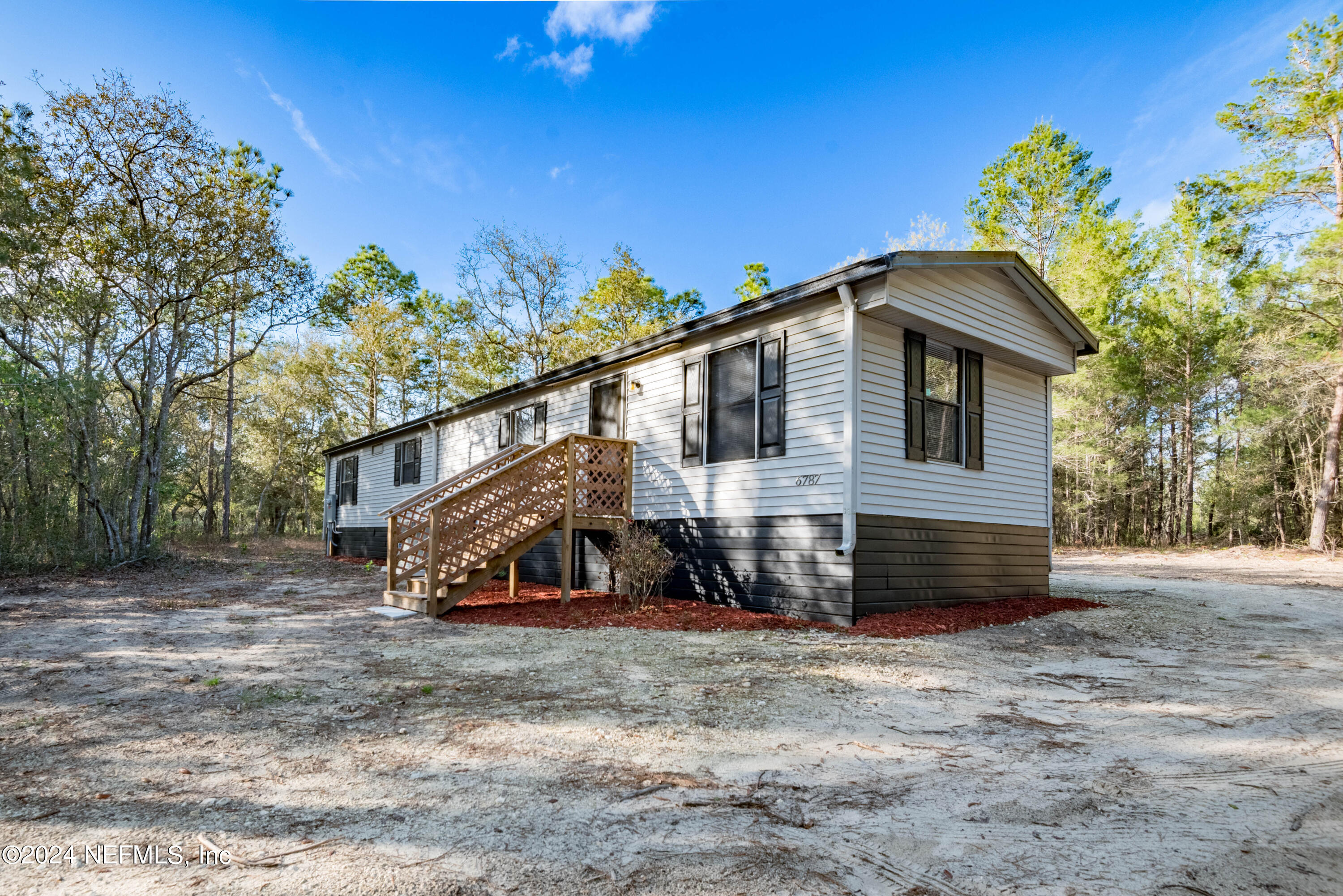 6787 Deer Springs Road Keystone Heights, FL 32656 - Photo 2 of 54 a view of a house with a yard