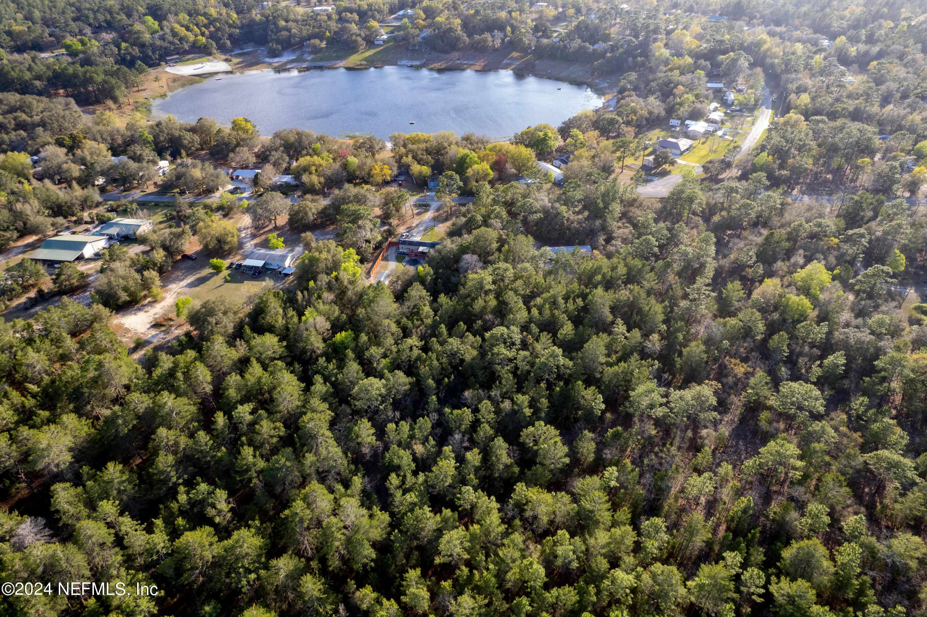 6787 Deer Springs Road Keystone Heights, FL 32656 - Photo 26 of 54 a view of a houses with a yard