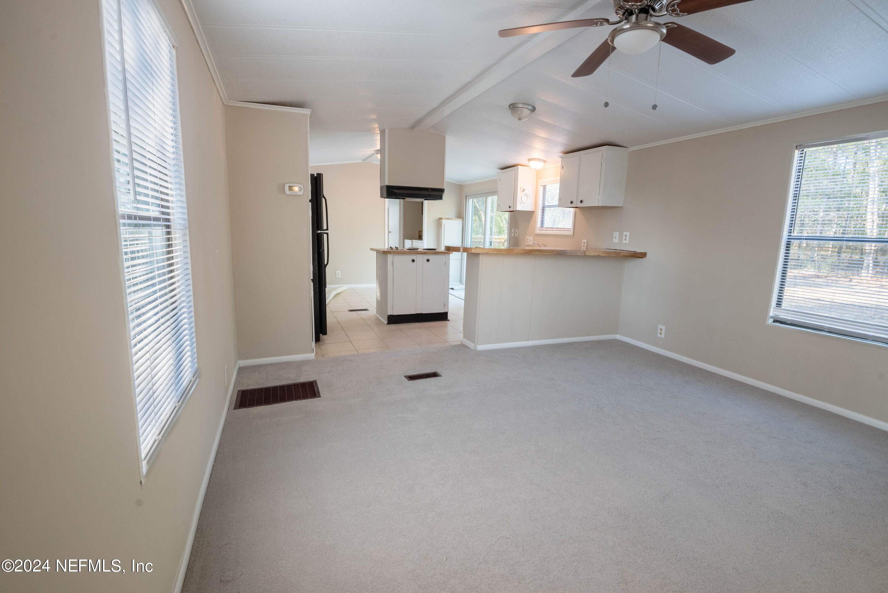 6787 Deer Springs Road Keystone Heights, FL 32656 - Photo 32 of 54 a view of kitchen with furniture and windows