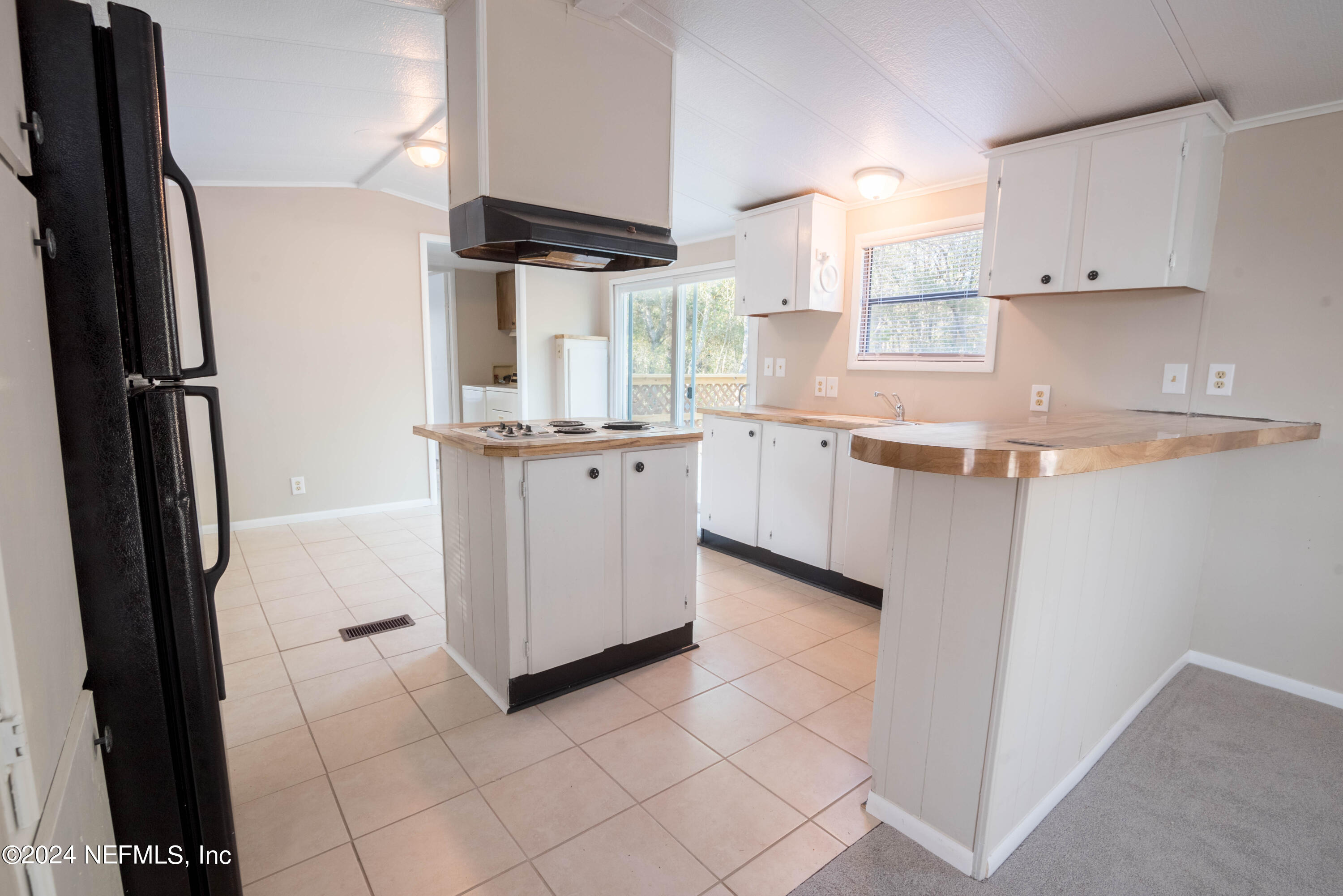 6787 Deer Springs Road Keystone Heights, FL 32656 - Photo 35 of 54 a kitchen with stainless steel appliances granite countertop a refrigerator and a stove