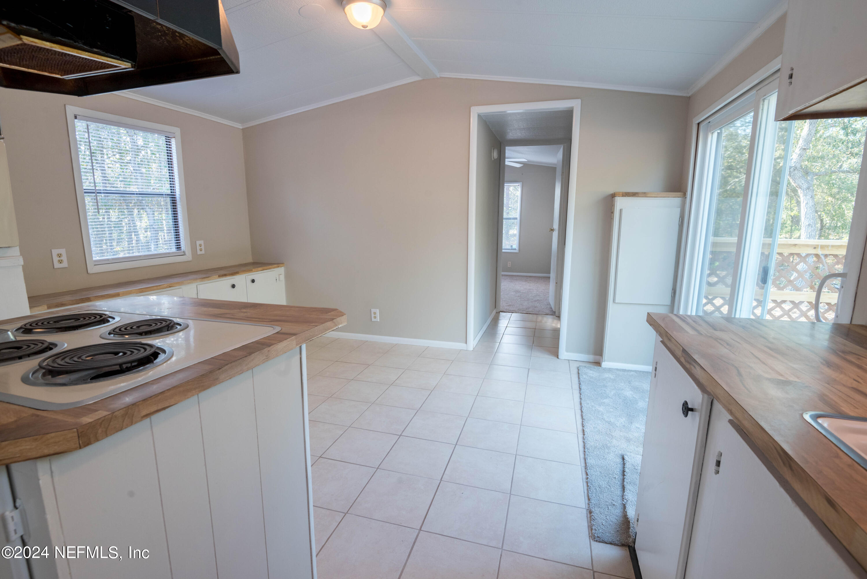 6787 Deer Springs Road Keystone Heights, FL 32656 - Photo 38 of 54 a kitchen that has a sink a stove and window