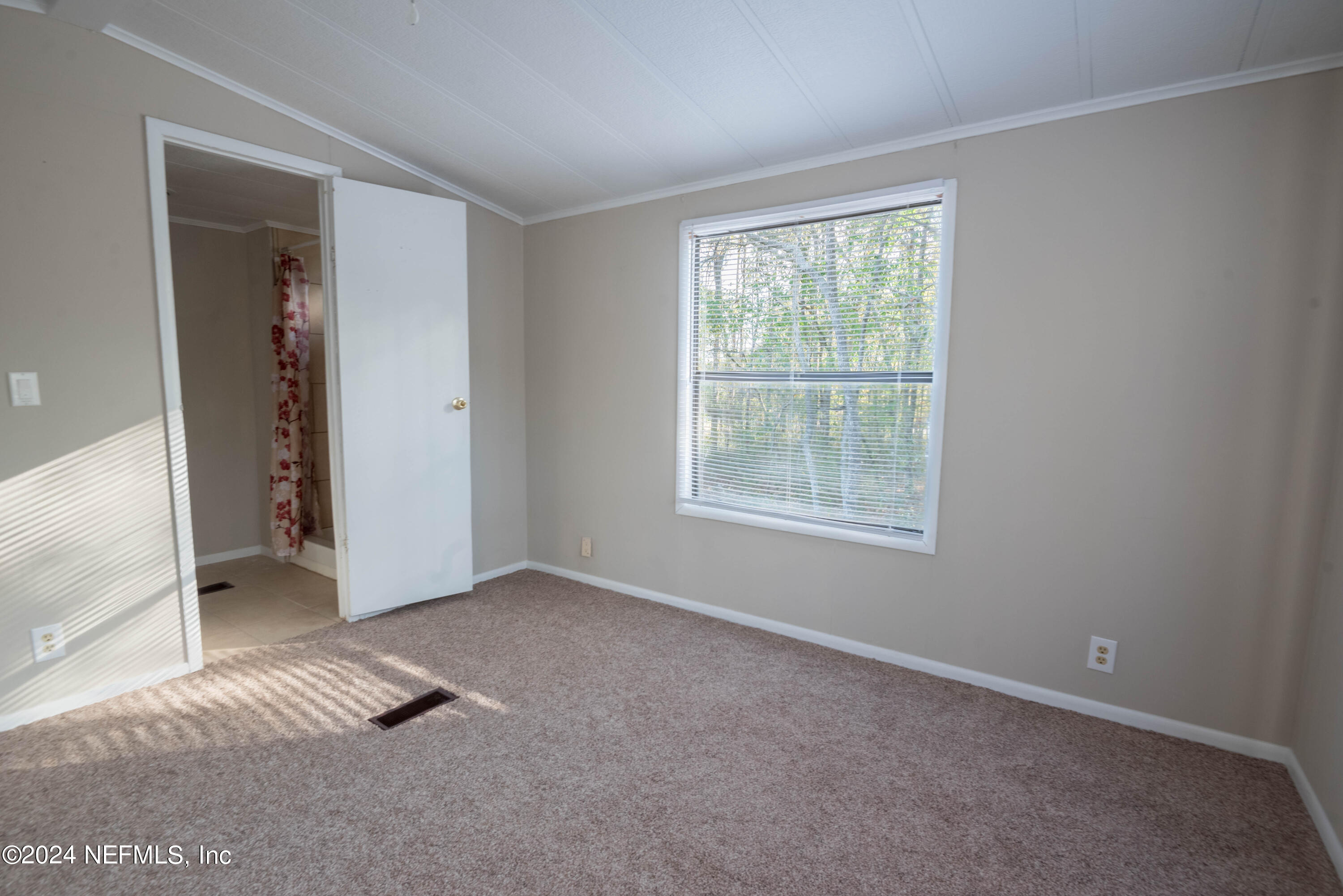 6787 Deer Springs Road Keystone Heights, FL 32656 - Photo 45 of 54 a view of an empty room with a window