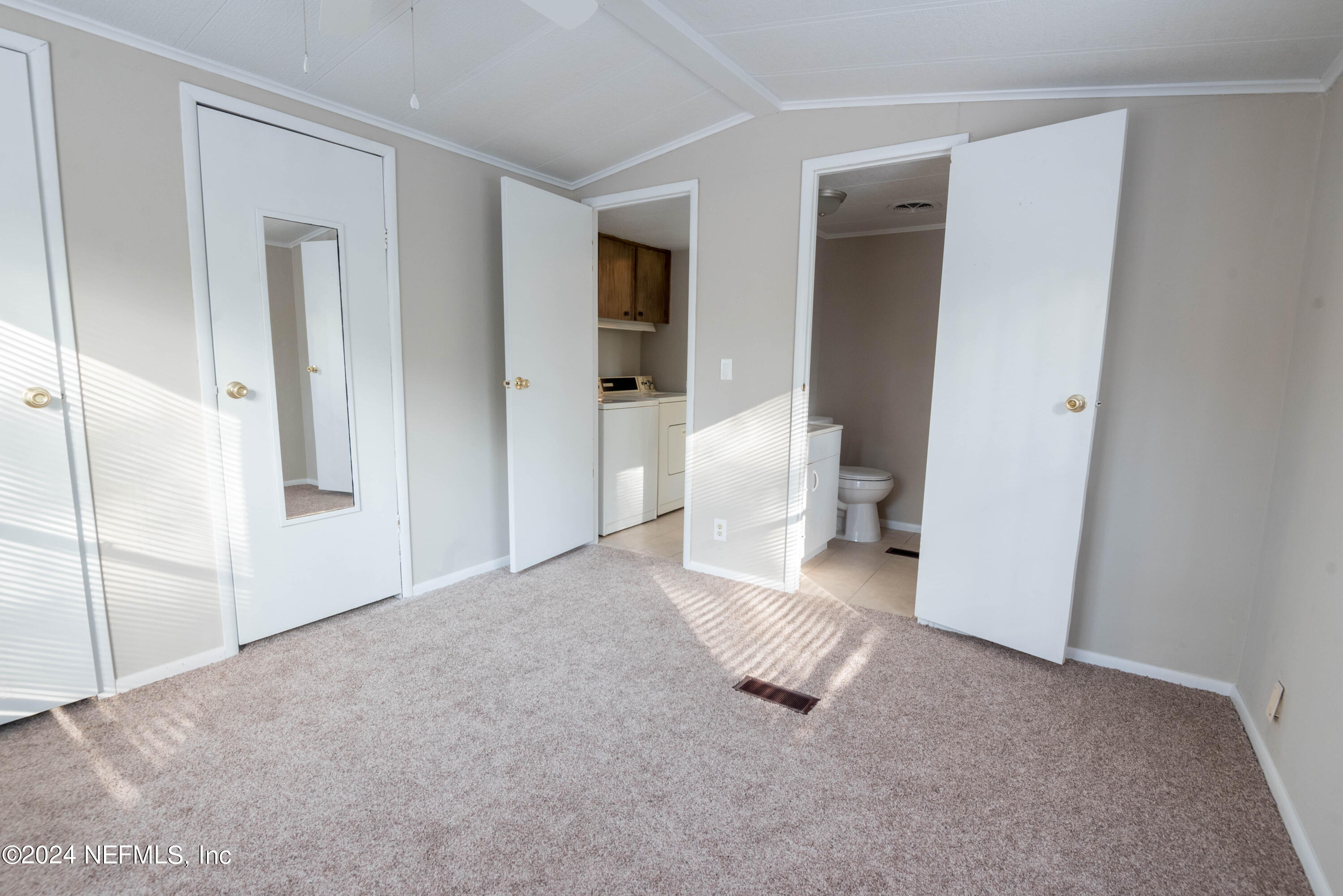 6787 Deer Springs Road Keystone Heights, FL 32656 - Photo 46 of 54 a view of a room with large windows