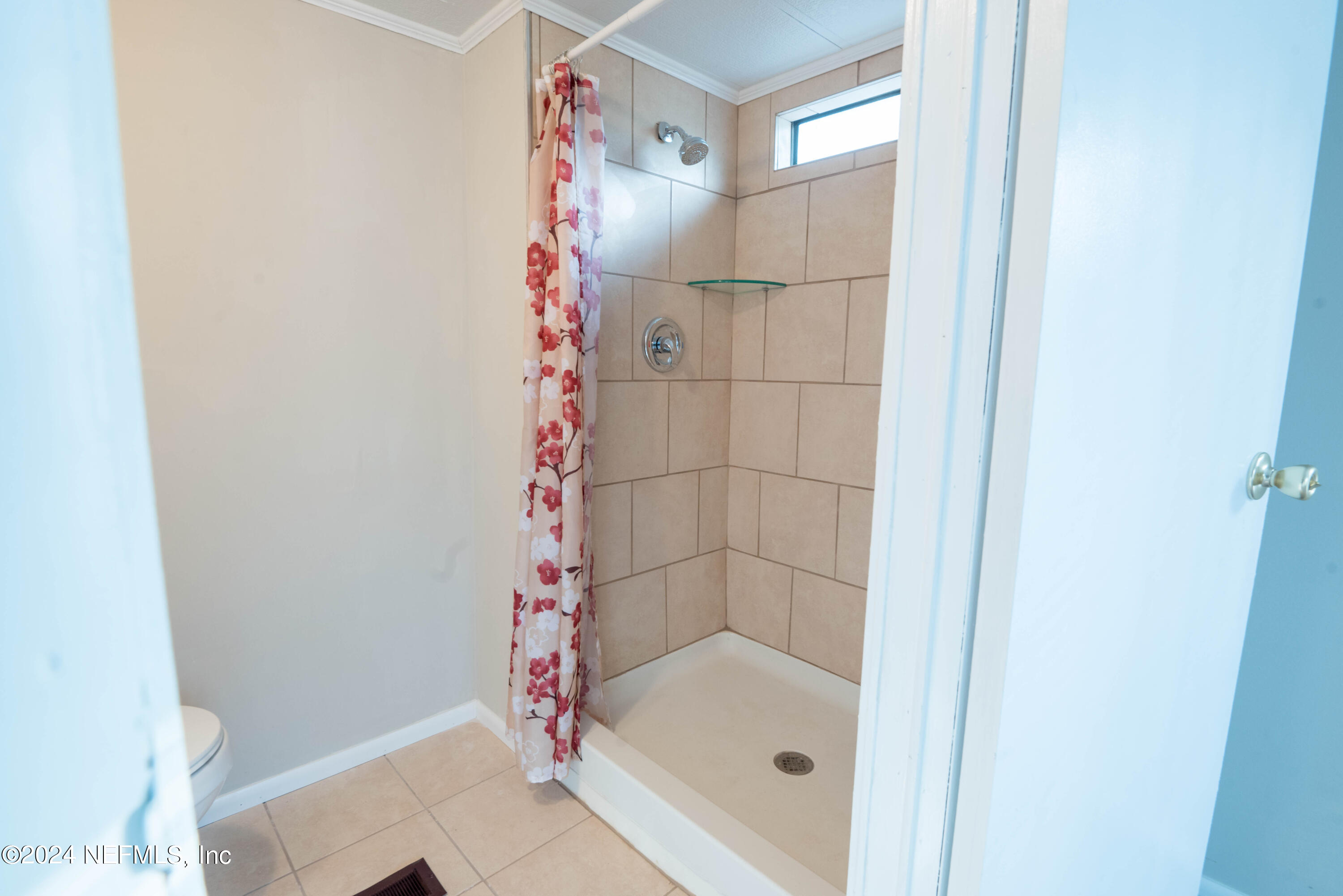 6787 Deer Springs Road Keystone Heights, FL 32656 - Photo 49 of 54 a bathroom with a bathtub