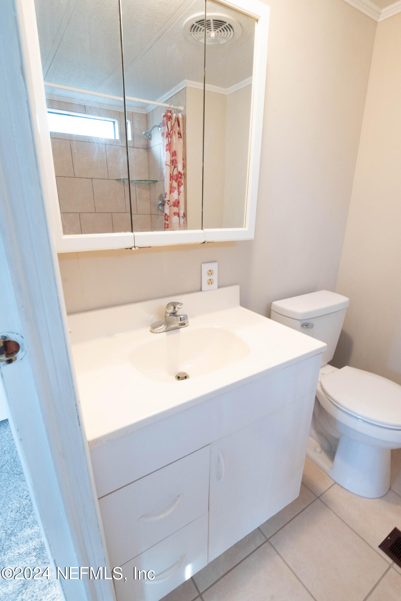 6787 Deer Springs Road Keystone Heights, FL 32656 - Photo 50 of 54 a bathroom with a sink a toilet and mirror