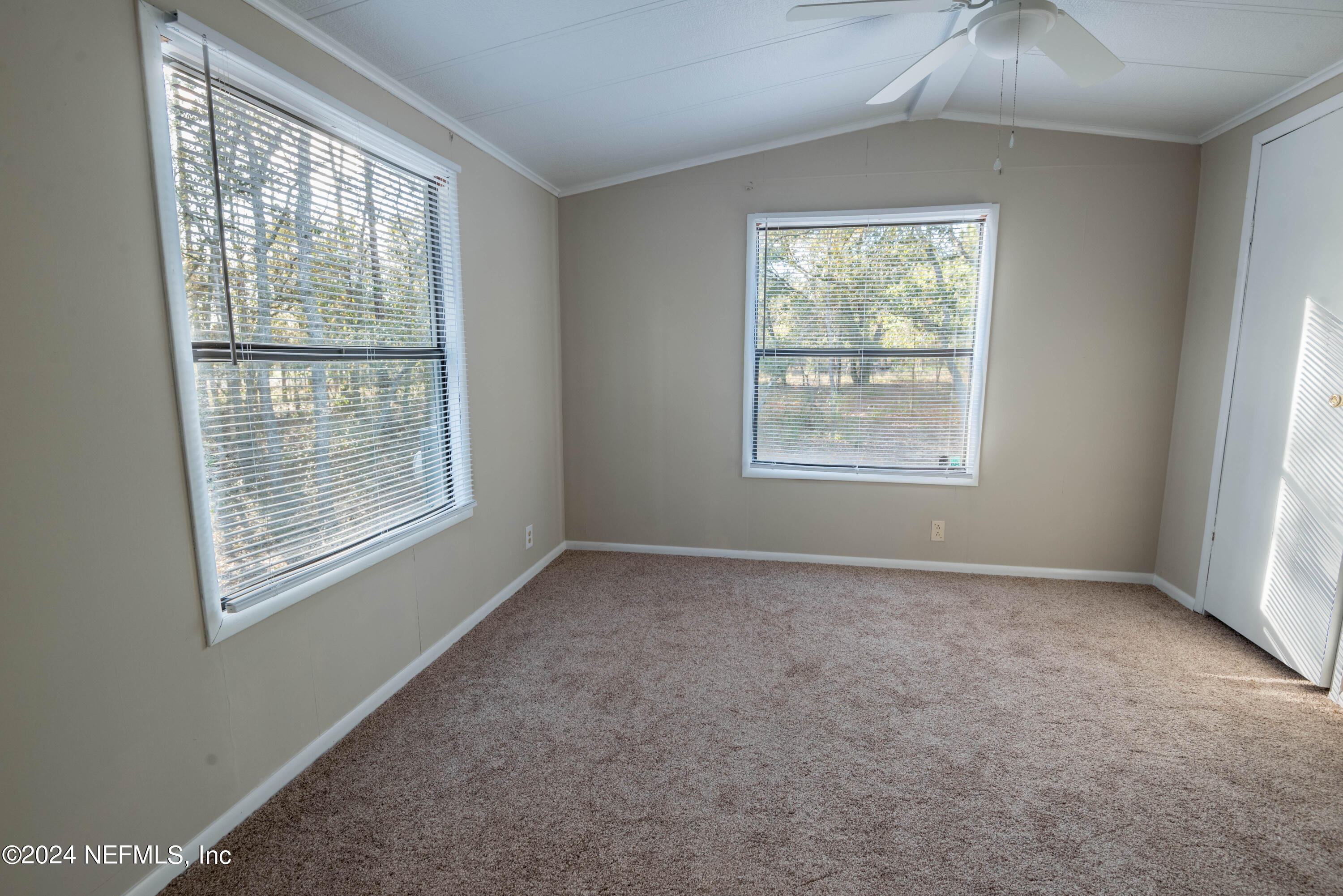 6787 Deer Springs Road Keystone Heights, FL 32656 - Photo 52 of 54 an empty room with a window
