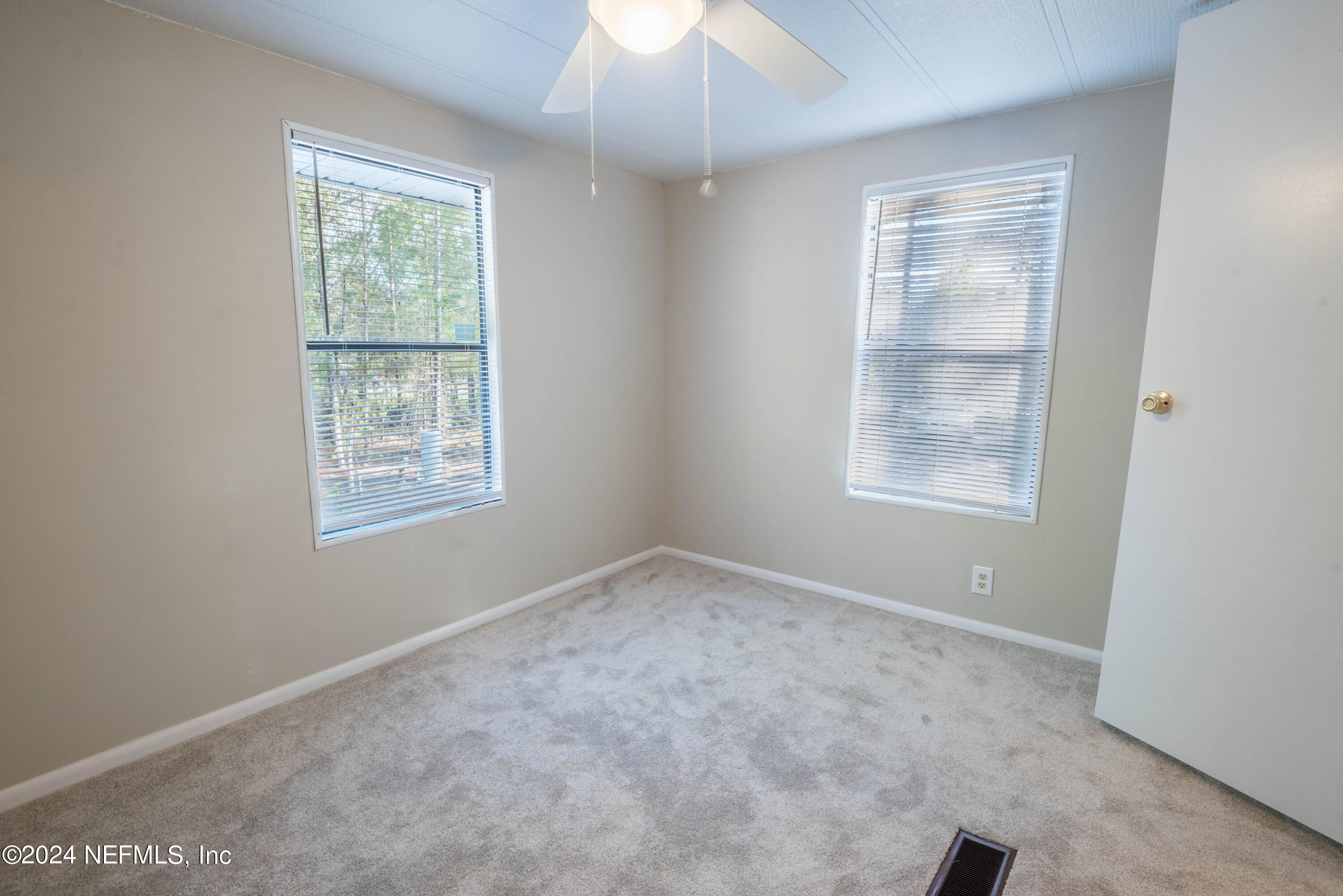 6787 Deer Springs Road Keystone Heights, FL 32656 - Photo 54 of 54 an empty room with a window