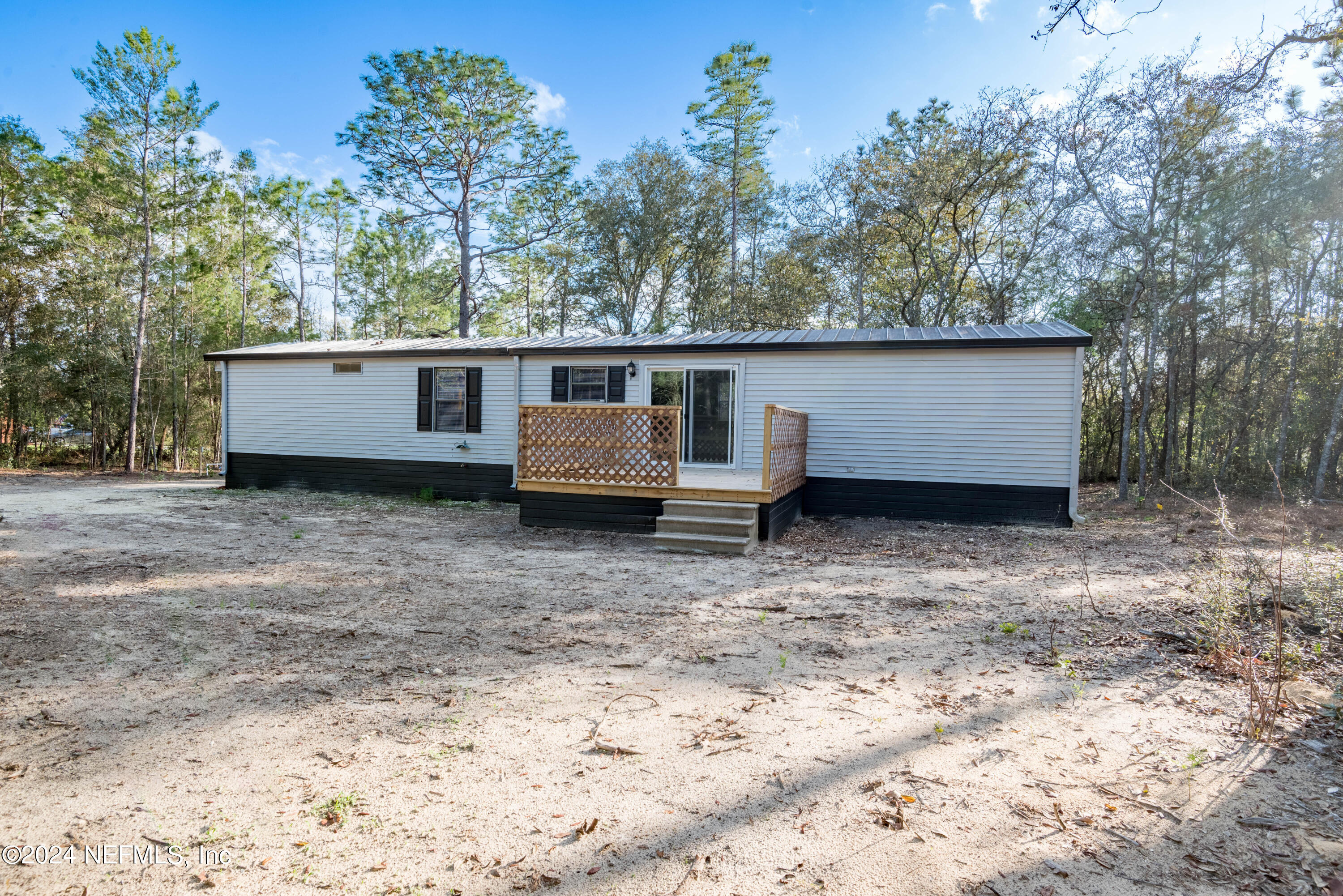6787 Deer Springs Road Keystone Heights, FL 32656 - Photo 8 of 54 a house view with a backyard space