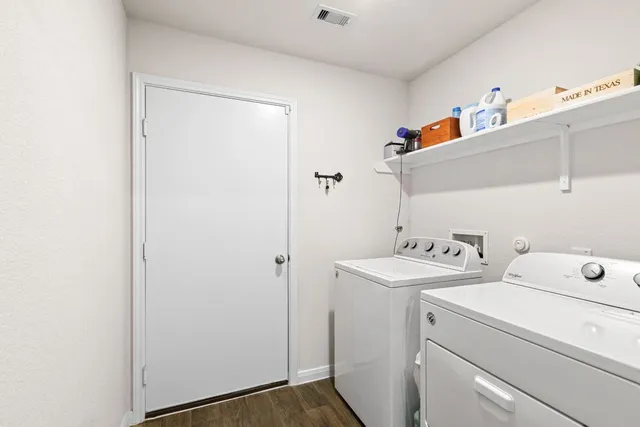 a utility room with dryer and washer