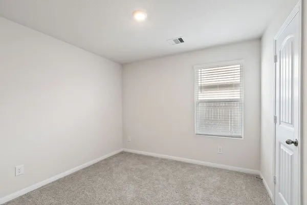 a bedroom with a bed and closet