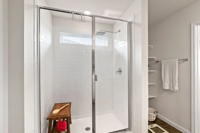 a view of a balcony with chair and a potted plant